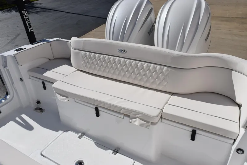 Slide: The Image of 2026 Sea Hunt Ultra 285 SE boat with luxurious white seating and dual engines. - 12