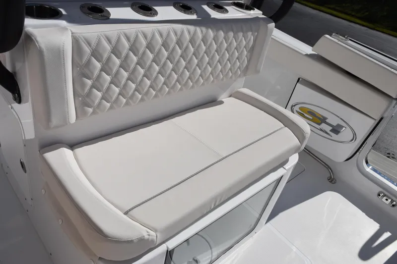 Slide: The Image of Luxurious seating on 2026 Sea Hunt Ultra 285 SE boat with quilted upholstery. - 13