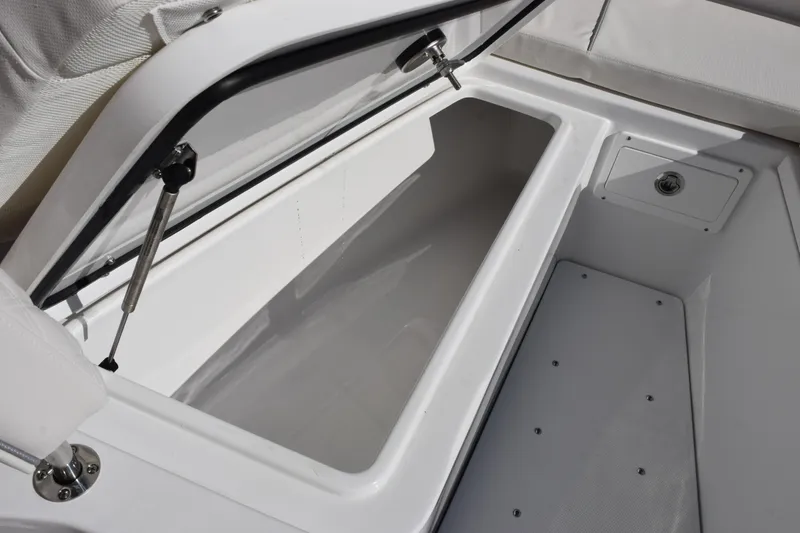 Slide: The Image of Open storage compartment on 2026 Sea Hunt Ultra 285 SE boat. - 18