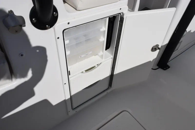 Slide: The Image of Open storage compartment on 2026 Sea Hunt Ultra 285 SE boat. - 23