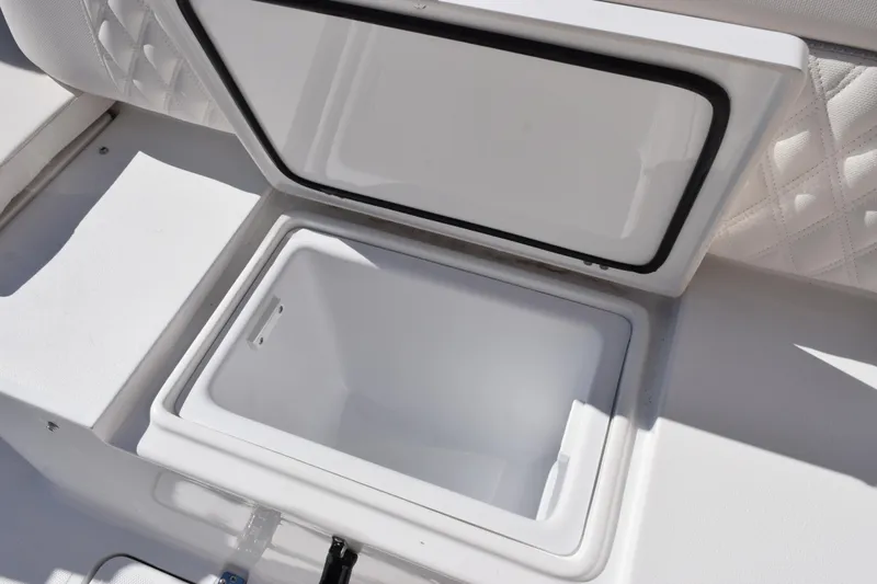 Slide: The Image of Open storage compartment on 2026 Sea Hunt Ultra 285 SE boat. - 25