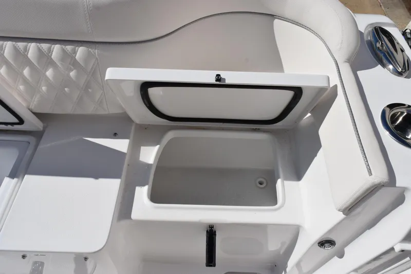 Slide: The Image of Open storage compartment on 2026 Sea Hunt Ultra 285 SE boat interior. - 27