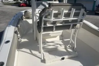 Slide: The Image of 2022 Key West 219 FS boat interior with seating and rod holders. - 6