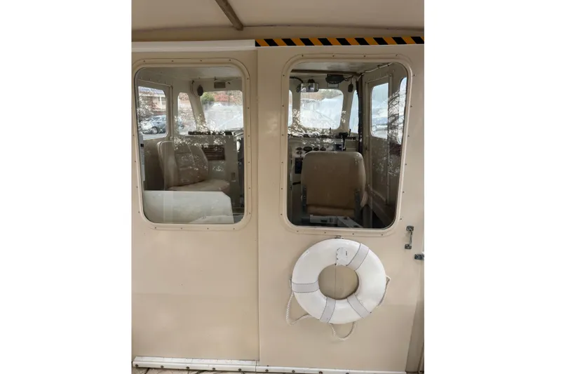 Slide: The Image of 1995 Rosborough 25 boat interior with life preserver on door. - 3