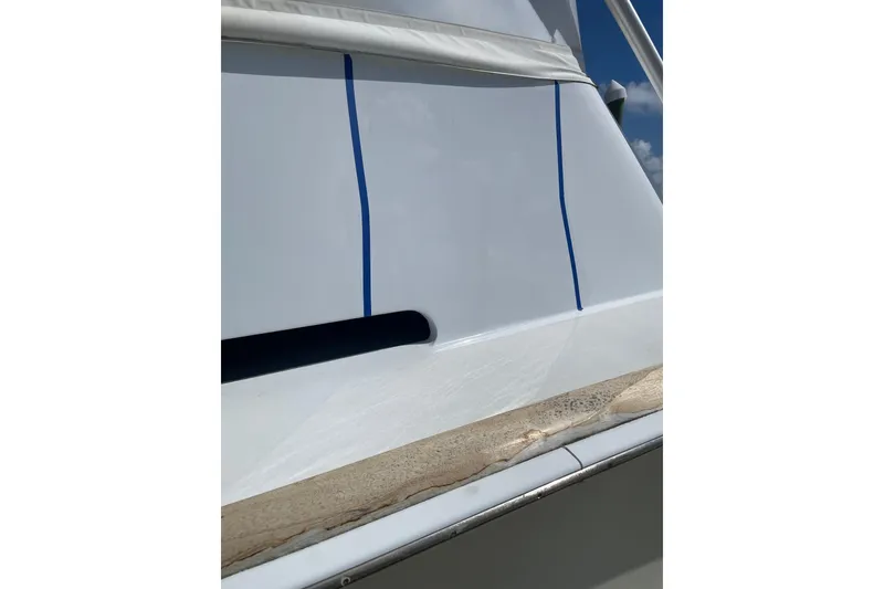 Slide: The Image of Close-up of Mockingbird Marine Custom 48 boat exterior, showcasing sleek design and detailing. - 10