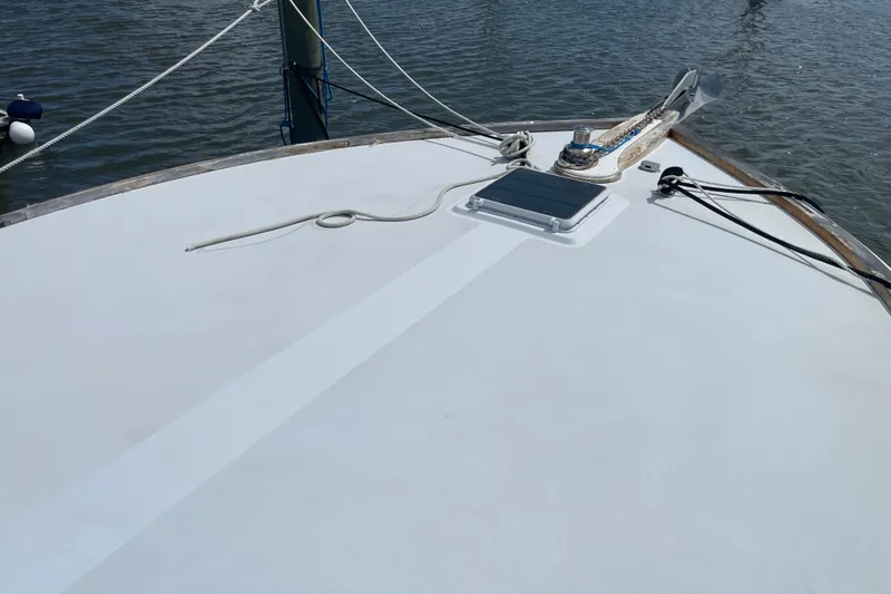 Slide: The Image of Deck of 2000 Mockingbird Marine Custom 48 sailboat with ropes and solar panel. - 16