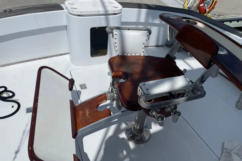 Slide: The Image of Mockingbird Marine Custom 48 yacht deck with wooden fishing chair, 2000 model. - 17