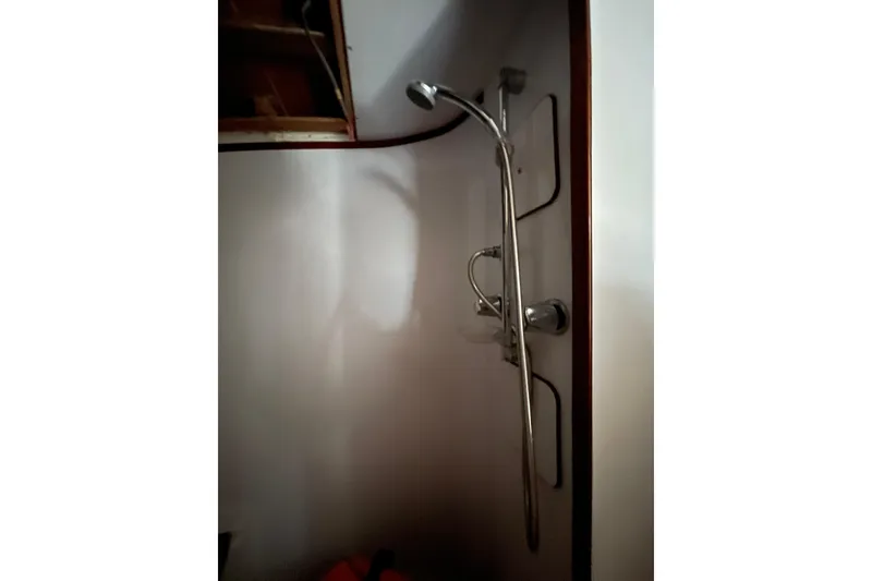 Slide: The Image of Shower area inside 2000 Custom Mockingbird Marine 48 Sportfish boat. - 22