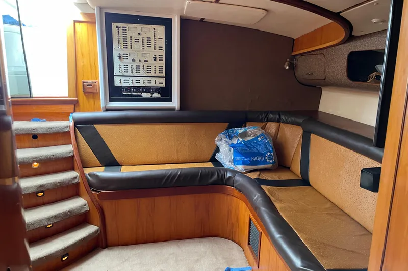 Slide: The Image of Interior of 2000 Custom Mockingbird Marine 48 Sportfish with seating and control panel. - 23