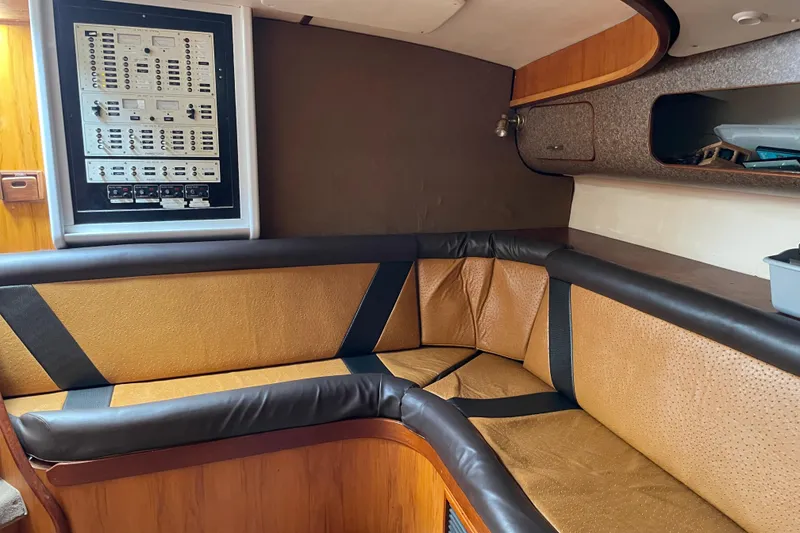 Slide: The Image of Interior of 2000 Custom Mockingbird Marine 48 Sportfish with leather seating and control panel. - 29