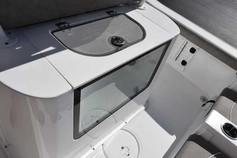 Slide: The Image of 2026 Sea Hunt BX 25 FS boat interior, featuring a sleek storage compartment and seating area. - 11