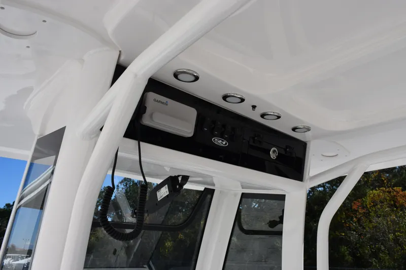 Slide: The Image of 2026 Sea Hunt BX 25 FS boat console with Garmin electronics and sleek design. - 13