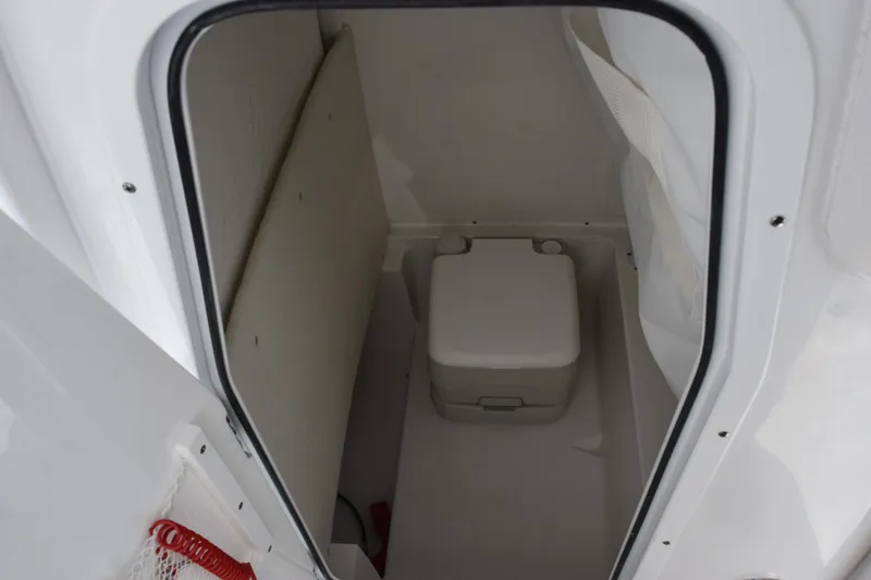 Slide: The Image of 2026 Sea Hunt BX 25 FS boat interior with compact toilet compartment. - 17