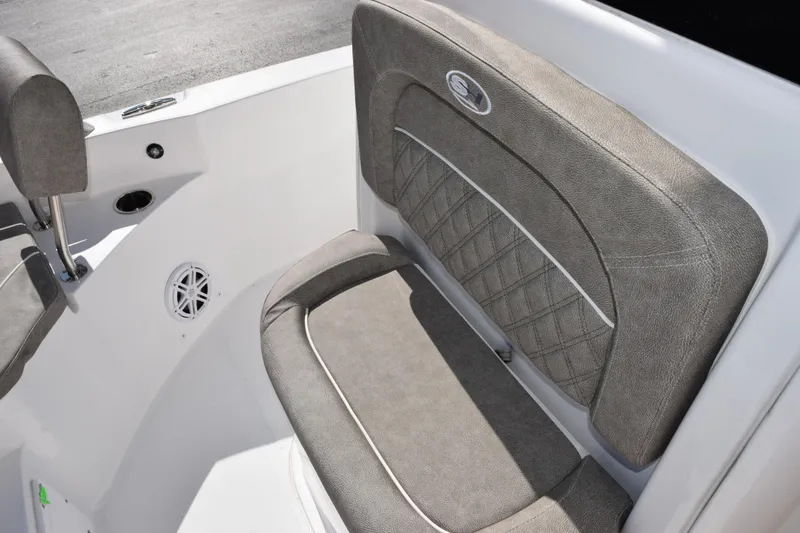 Slide: The Image of 2026 Sea Hunt BX 25 FS boat interior seating with gray upholstery and speaker. - 19