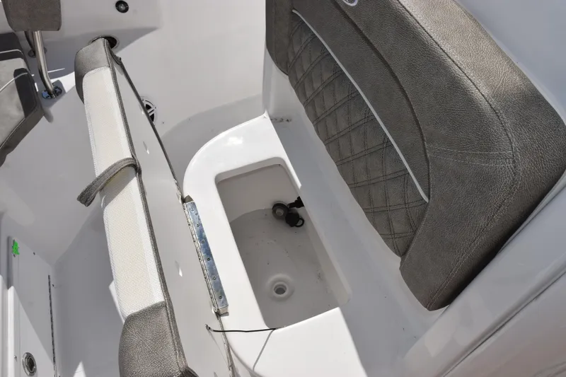 Slide: The Image of 2026 Sea Hunt BX 25 FS boat seat with storage compartment open. - 21