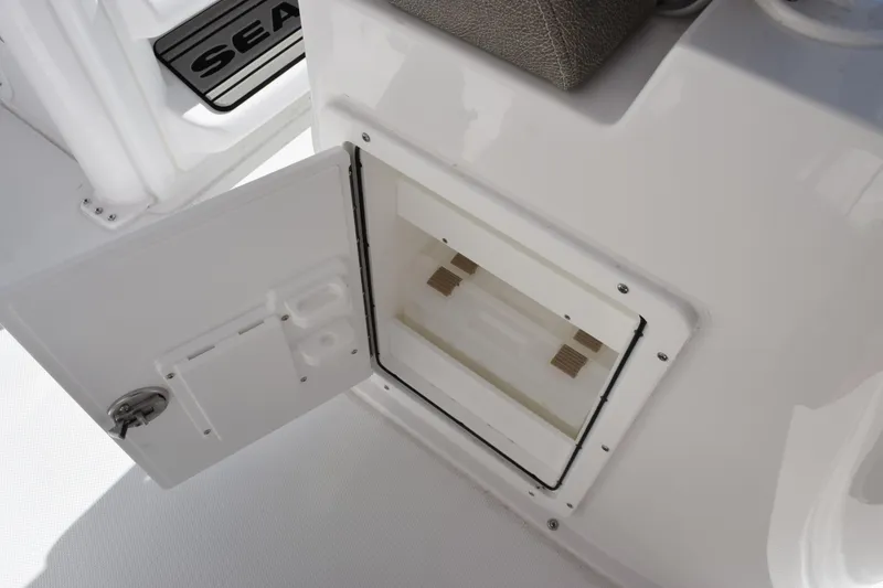 Slide: The Image of Open storage compartment on 2026 Sea Hunt BX 25 FS boat interior. - 24