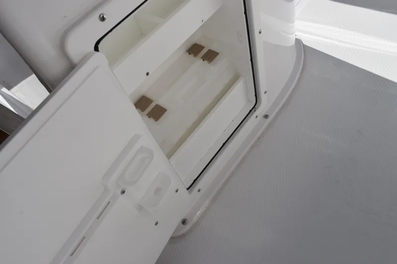 Slide: The Image of Open storage compartment on 2026 Sea Hunt BX 25 FS boat deck. - 28