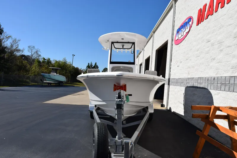 Slide: The Image of 2026 Sea Hunt BX 25 FS boat on trailer outside marine dealership. - 3