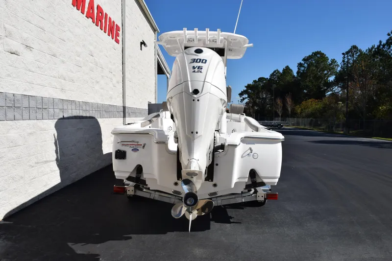 Slide: The Image of 2026 Sea Hunt BX 25 FS boat with powerful 300 V6 engine, parked outdoors. - 5