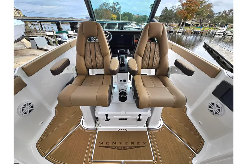 Slide: The Image of 2026 Monterey Elite 27 OB boat interior with luxurious seating and modern design. - 15
