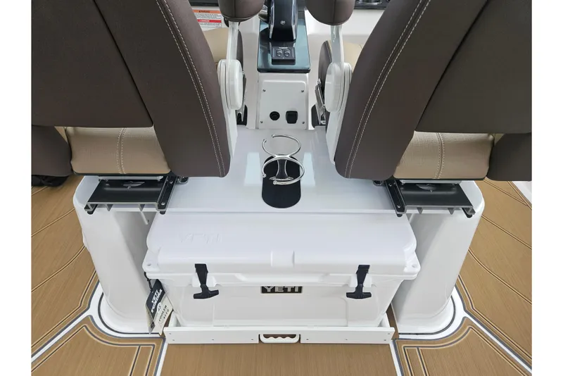 Slide: The Image of 2026 Monterey Elite 27 OB boat interior with Yeti cooler and dual cup holders. - 23