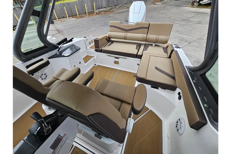 Slide: The Image of 2026 Monterey Elite 27 OB boat interior with luxurious seating and modern design. - 25
