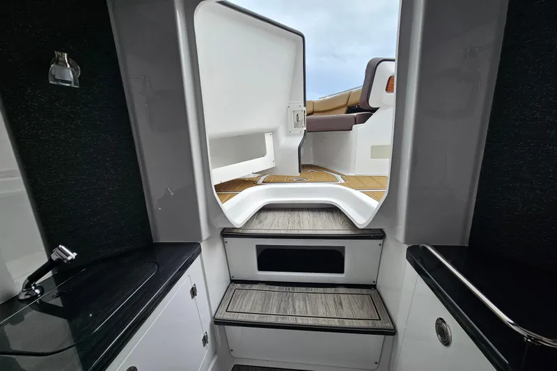 Slide: The Image of Interior view of 2026 Monterey Elite 27 OB boat, featuring sleek design and modern amenities. - 29