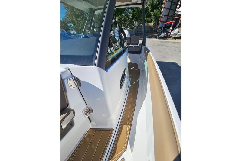 Slide: The Image of 2026 Monterey Elite 27 OB boat interior with sleek design and modern features. - 32