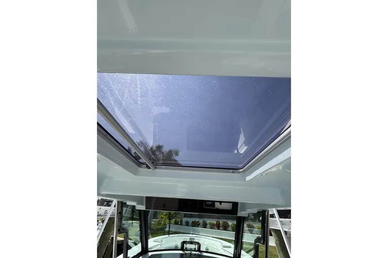 Slide: The Image of 2024 Bertram 39 CC boat with a clear skylight view. - 30