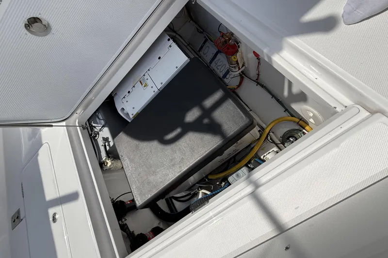Slide: The Image of 2024 Bertram 39 CC boat engine compartment with wiring and components. - 32