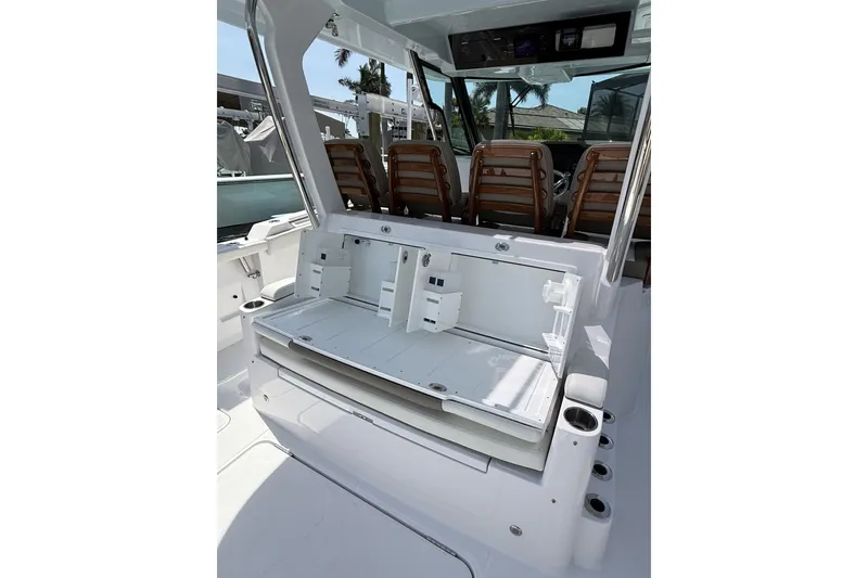 Slide: The Image of 2024 Bertram 39 CC boat interior with seating and storage compartments. - 37
