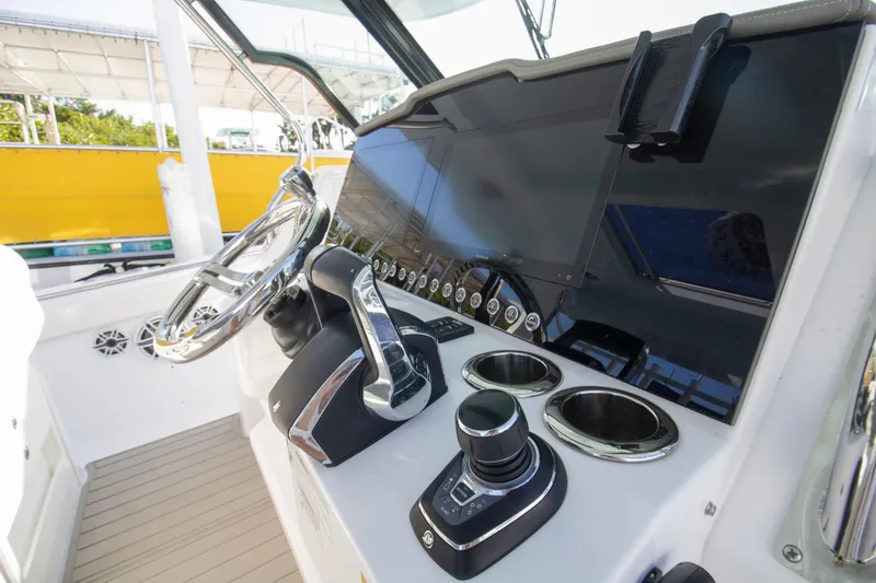 Slide: The Image of 2024 Bertram 39 CC boat helm with modern controls and steering wheel. - 79