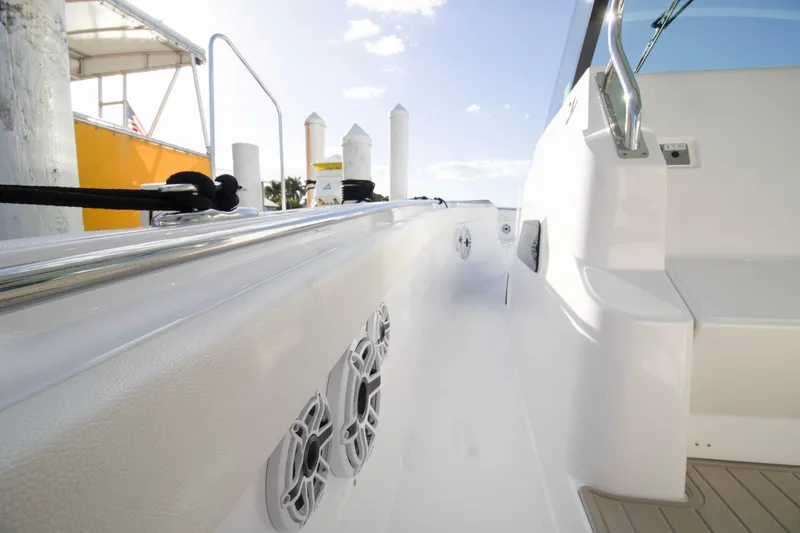 Slide: The Image of 2024 Bertram 39 CC boat deck with sleek white finish and modern design. - 88