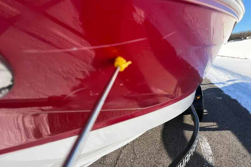 Slide: The Image of Red 2010 Chaparral 216 SSi boat on trailer, close-up view. - 18