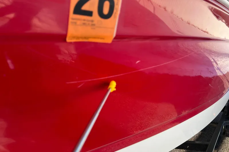 Slide: The Image of 2010 Chaparral 216 SSi boat with red hull and inspection sticker. - 20