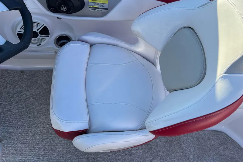 Slide: The Image of 2010 Chaparral 216 SSi boat interior with white and red seating. - 33