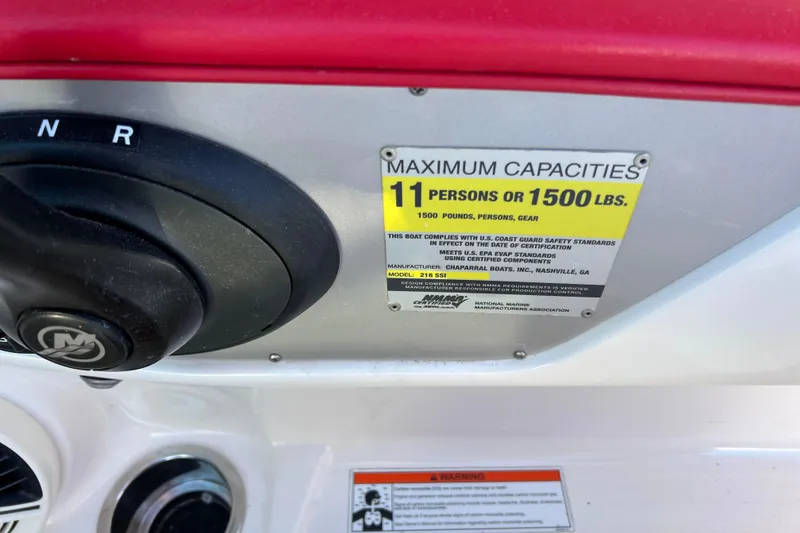 Slide: The Image of 2010 Chaparral 216 SSi boat capacity label, 11 persons or 1500 lbs limit. - 34