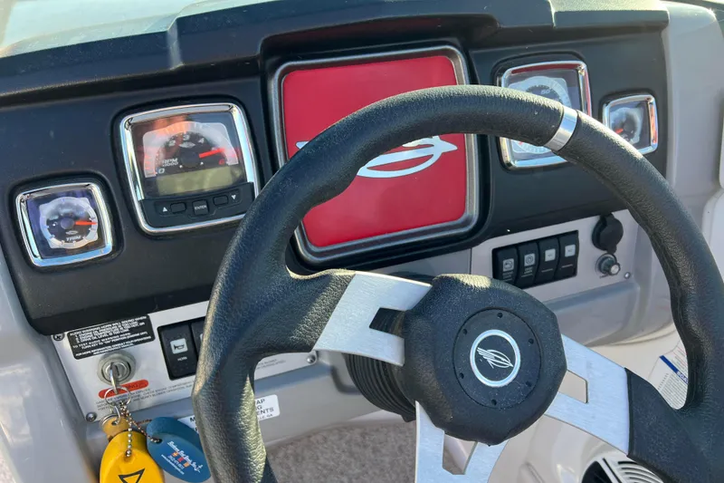 Slide: The Image of Steering wheel and dashboard of 2010 Chaparral 216 SSi boat. - 35