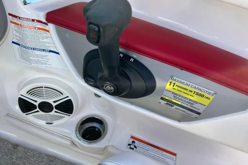 Slide: The Image of 2010 Chaparral 216 SSi boat control panel with capacity warning and speaker. - 38