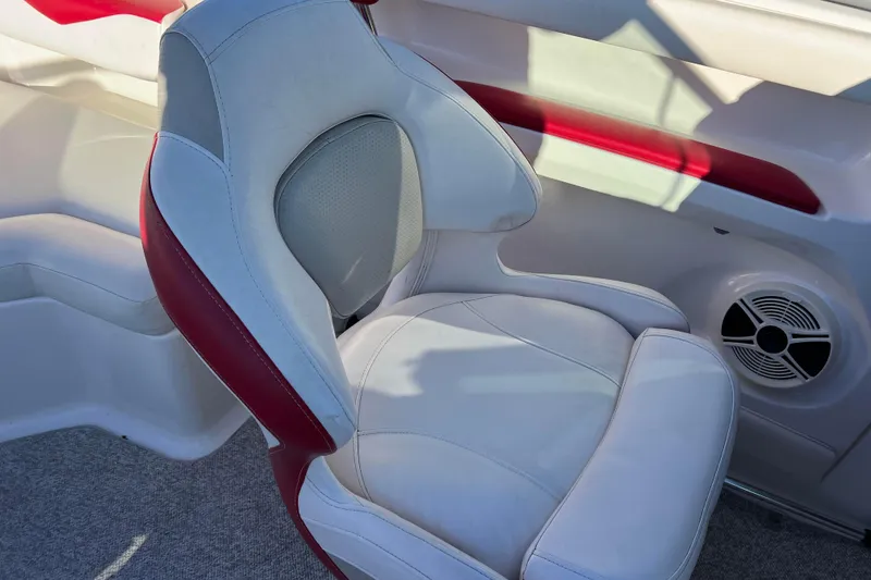 Slide: The Image of 2010 Chaparral 216 SSi boat interior with white and red seating and speaker. - 41