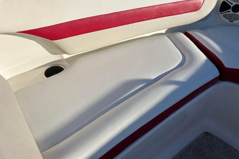 Slide: The Image of 2010 Chaparral 216 SSi boat interior with red and white seating. - 47