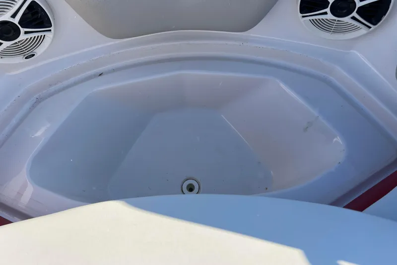 Slide: The Image of Interior of 2010 Chaparral 216 SSi boat with speakers and storage area. - 55