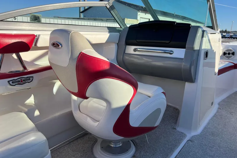 Slide: The Image of Interior of 2010 Chaparral 216 SSi boat with red and white seating. - 65