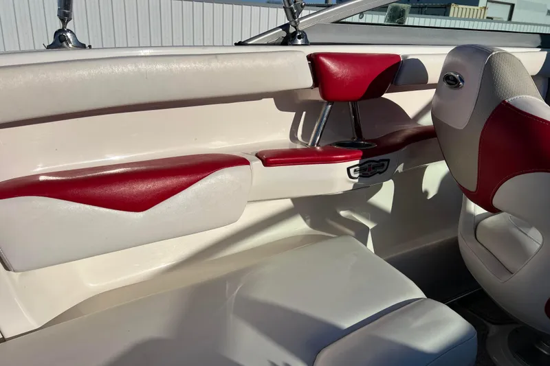 Slide: The Image of Interior of 2010 Chaparral 216 SSi boat with red and white seating. - 72