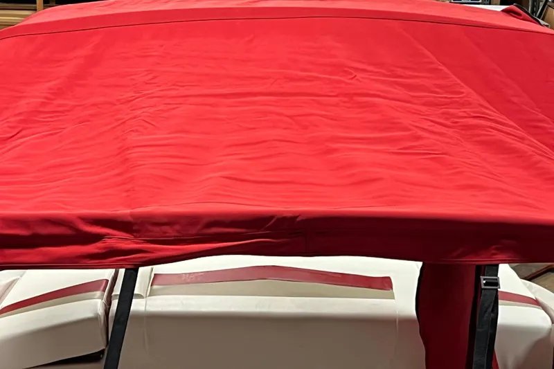 Slide: The Image of Red canopy on 2010 Chaparral 216 SSi boat, partially covering white seats. - 90