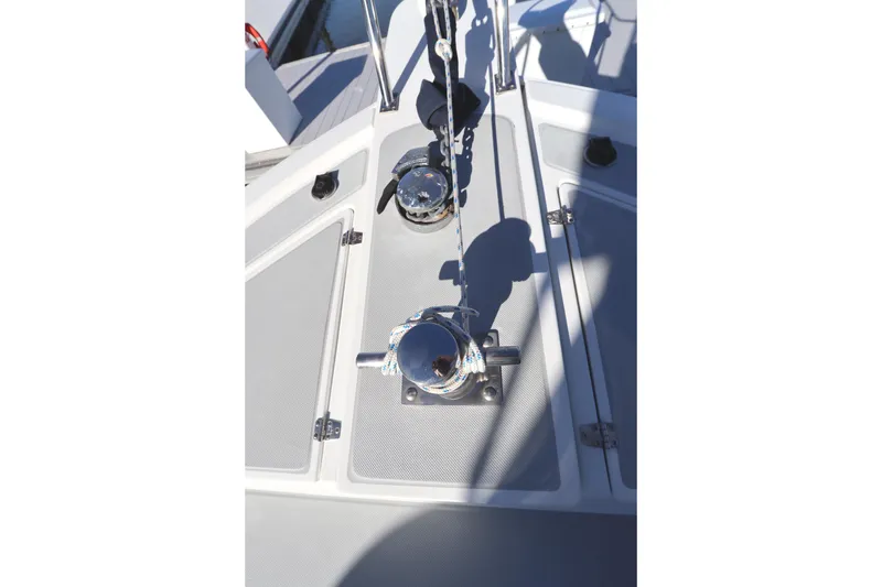 Slide: The Image of Deck of 2005 Monk 36 boat with polished metal fittings and rope. - 14