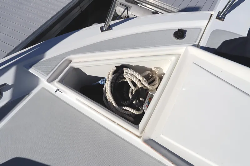 Slide: The Image of Storage compartment on a 2005 Monk 36 boat, containing coiled rope. - 15