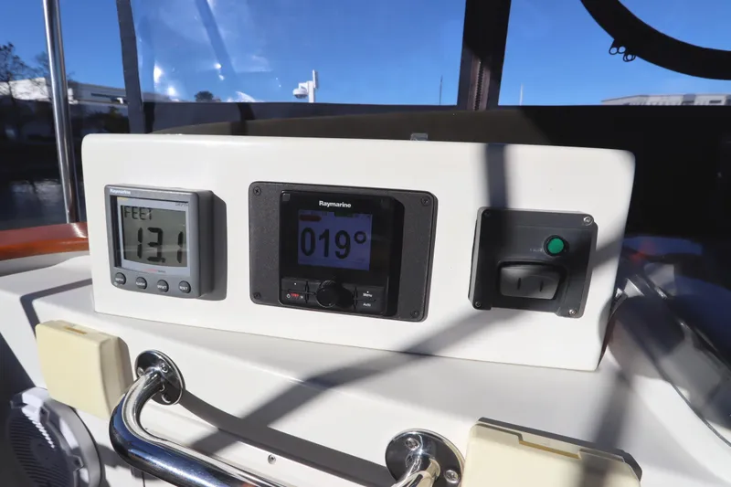 Slide: The Image of Control panel of a 2005 Monk 36 boat with navigation instruments. - 30