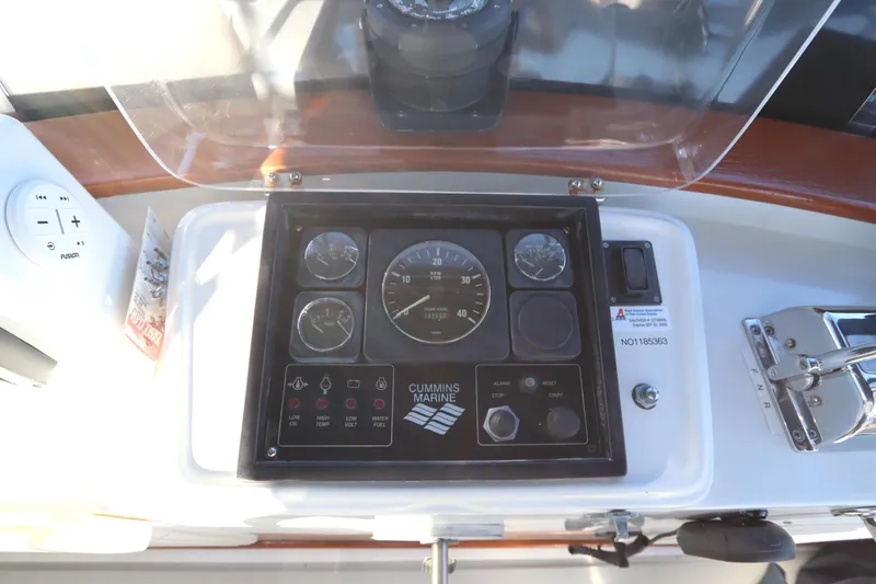 Slide: The Image of Control panel of a 2005 Monk 36 boat with Cummins Marine gauges. - 31