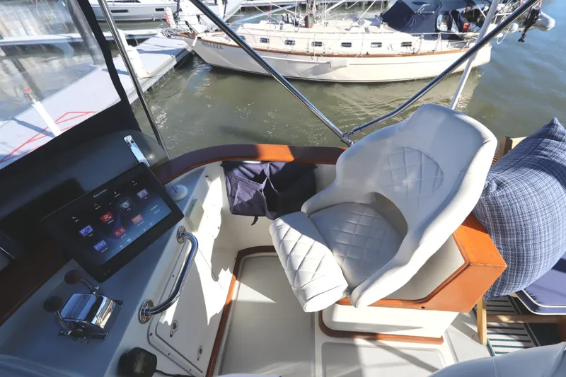Slide: The Image of Helm of 2005 Monk 36 yacht with modern controls and comfortable seating. - 37